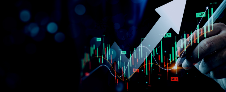 A man points at a graph with a pen in hand, emphasizing key data points and trading indicators during a discussion or presentation."